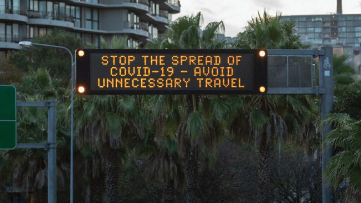 Covid Warning Sign in traffic
