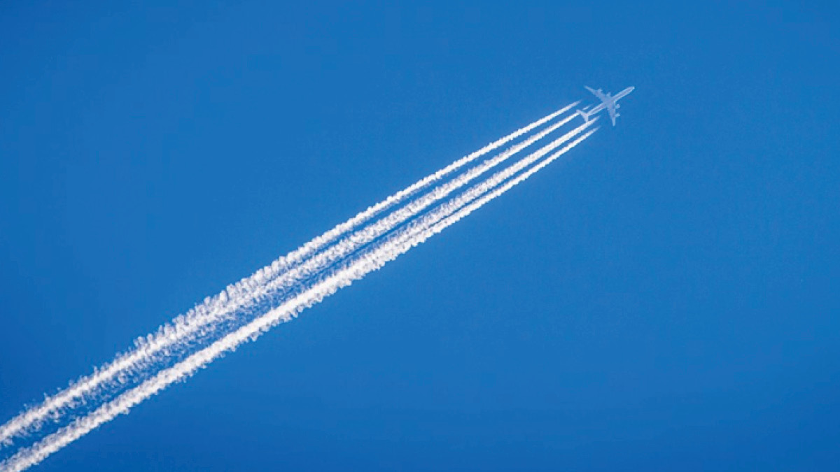 Airplane contrails in blue sky