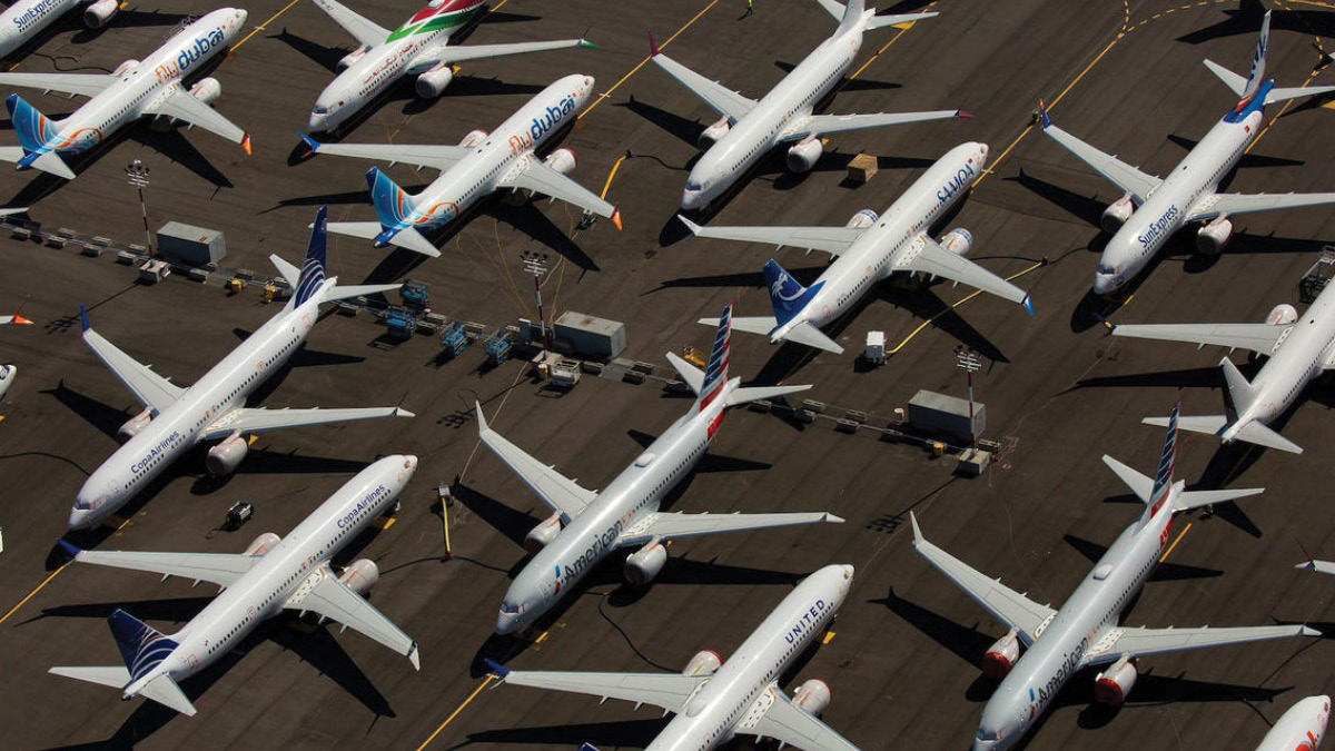 Planes parked uniformly on runway