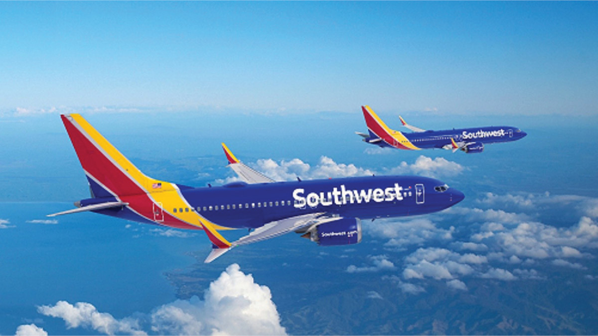 Two Southwest Airlines airplanes flying side by side