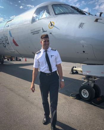 Pilot Drew standing outside aircraft