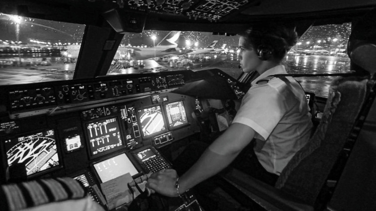 Pilot Eva in cockpit flying plane